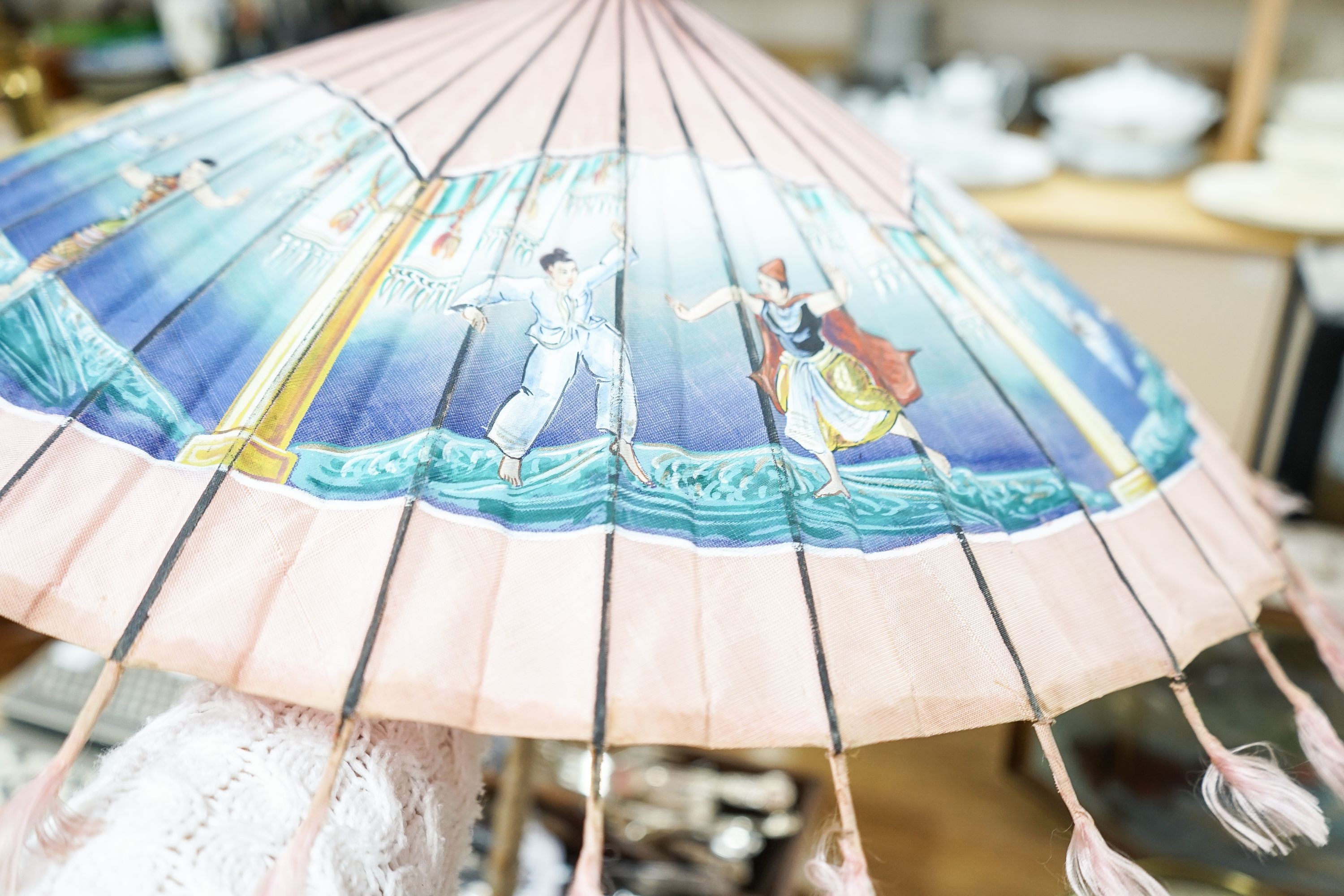 A 19th century Chinese Canton export ivory parasol with carved Ivory handle and a Burmese white metal handled painted fabric parasol